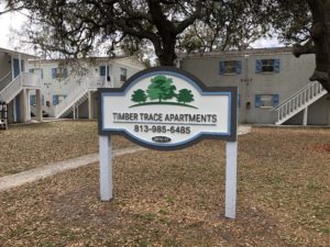 Routed sign for rear community entrance